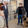 President Preston talks with Steve Johnson, an online instructor with his service dog, Flynn.